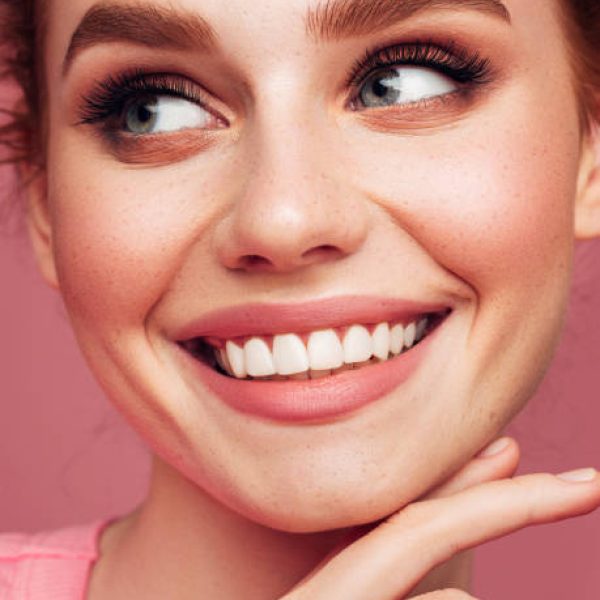 Close-up portrait of smiling girl with beautiful make-up